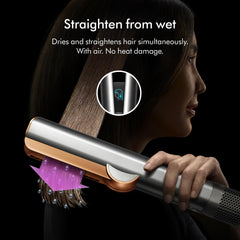 Dyson Airstrait rose gold handle closeup showing ergonomic grip benefit