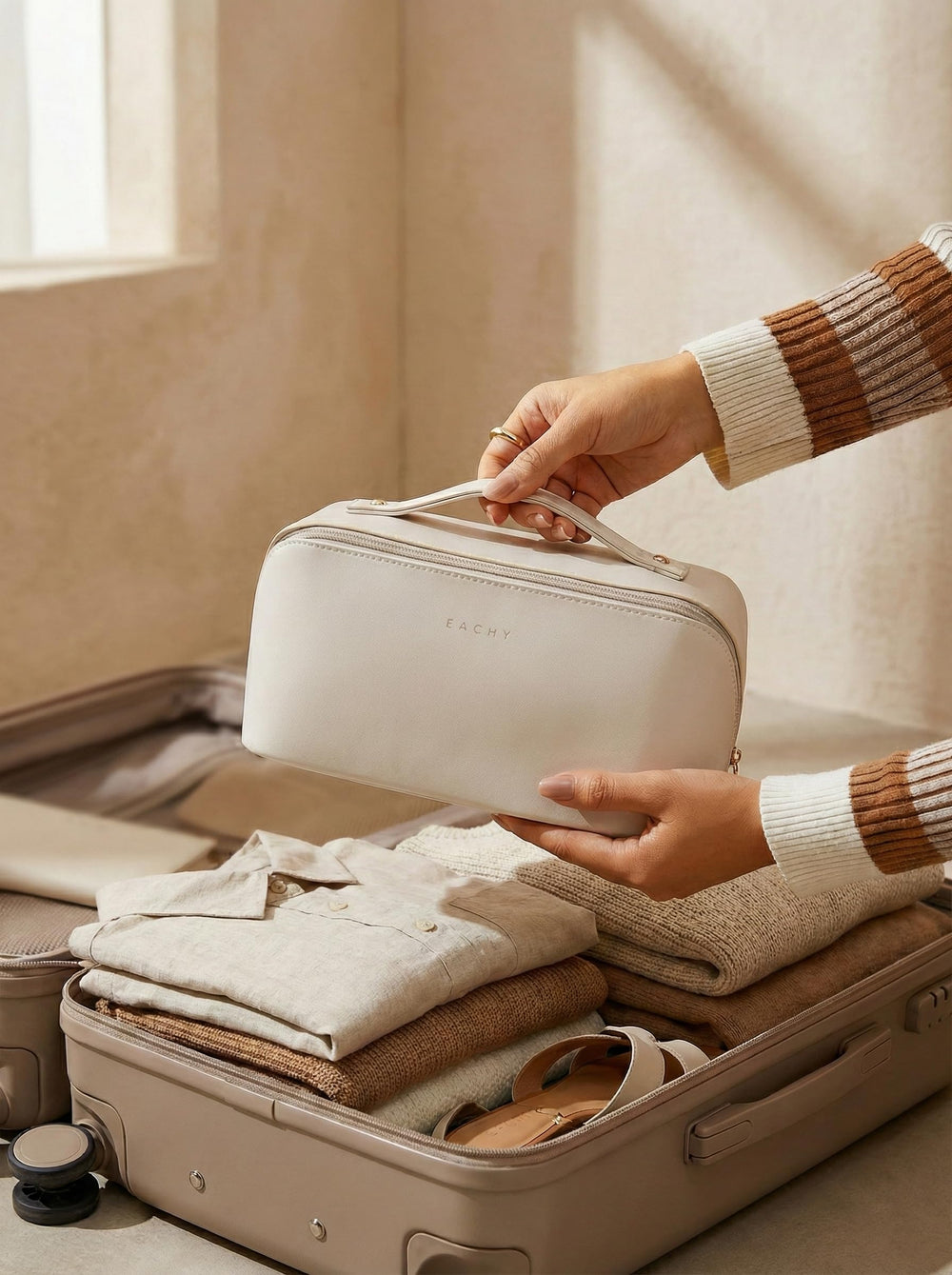 EACHY bag filled with skincare and makeup to show capacity and travel convenience benefit