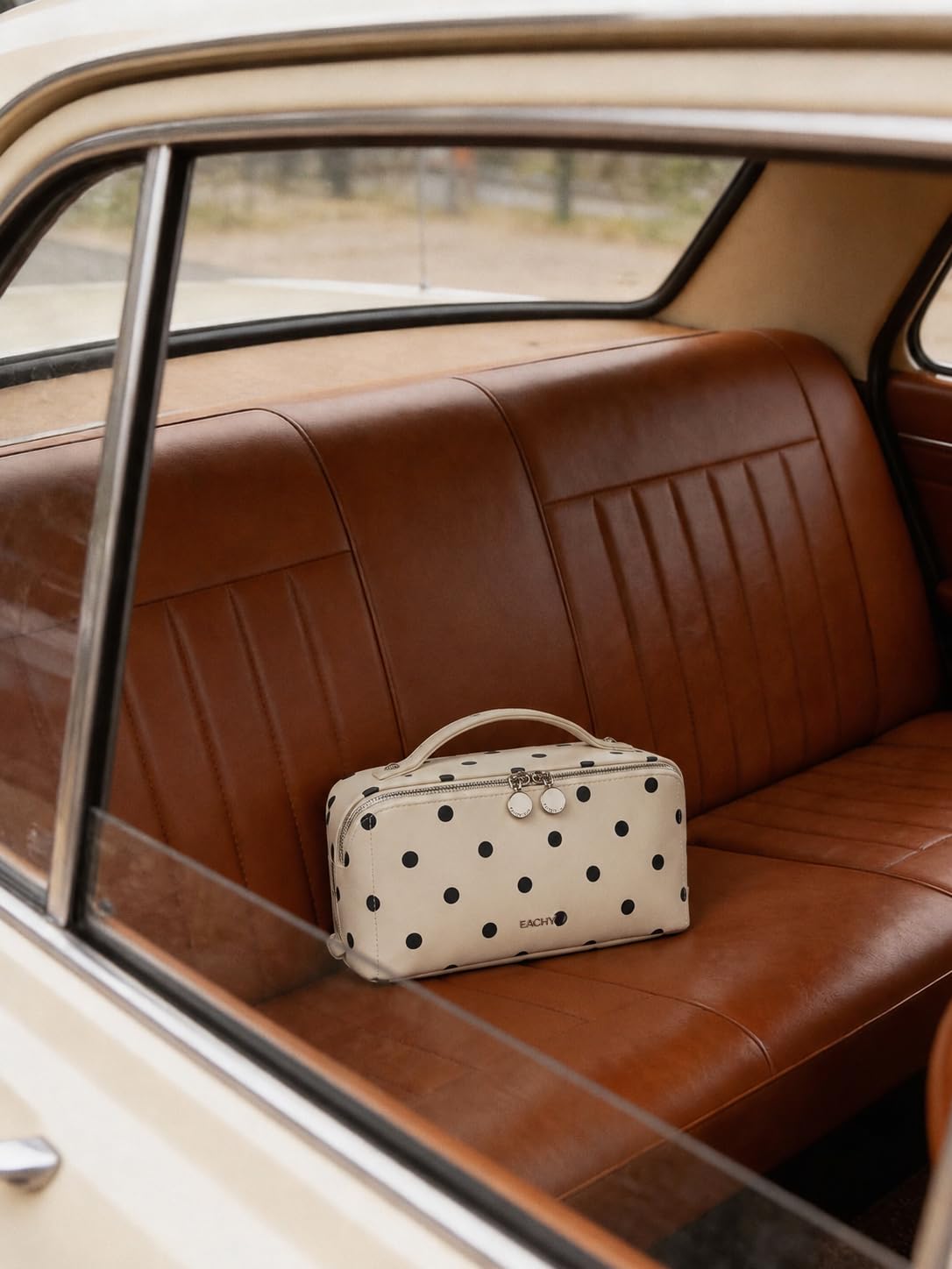 EACHY on suitcase in travel scene demonstrating easy packing convenience