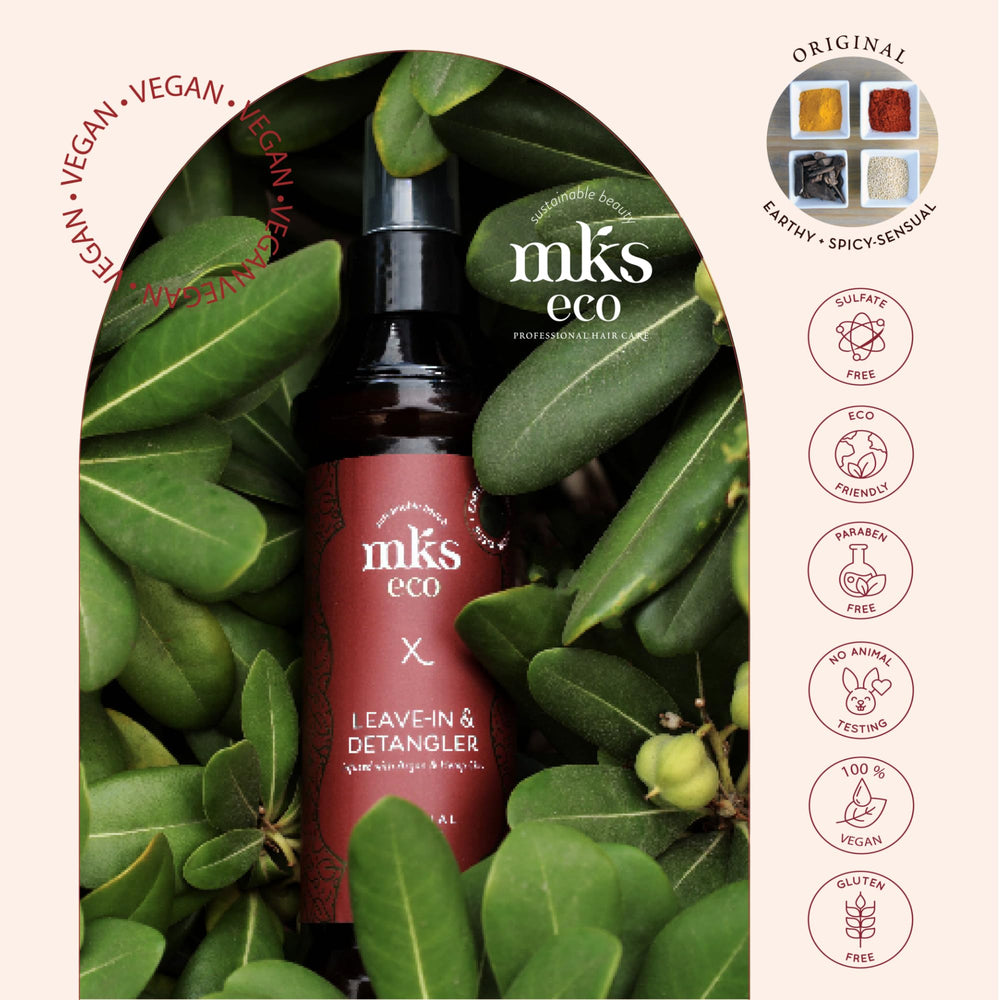 Earthly Body MKS eco X bottle in hand for scale showing compact travel-friendly size