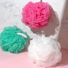 EcoTools pouf producing rich foam in hand to conserve body wash and create lather