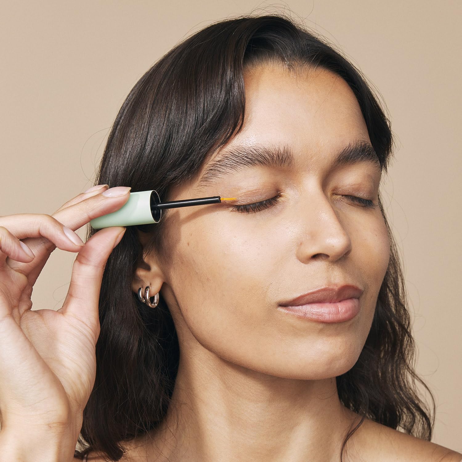 Eight Saints serum texture on fingertip showing lightweight hydration