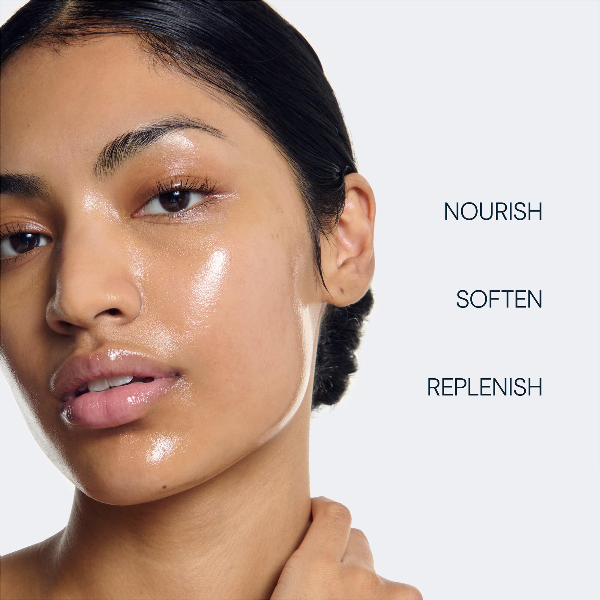 ELEMIS pink morning capsule held to show rose hydration and quick application