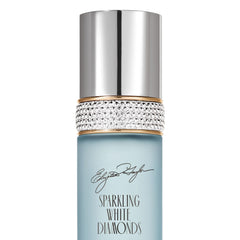 Elizabeth Taylor bottle on vanity styled with jewelry suggesting refined daytime elegance
