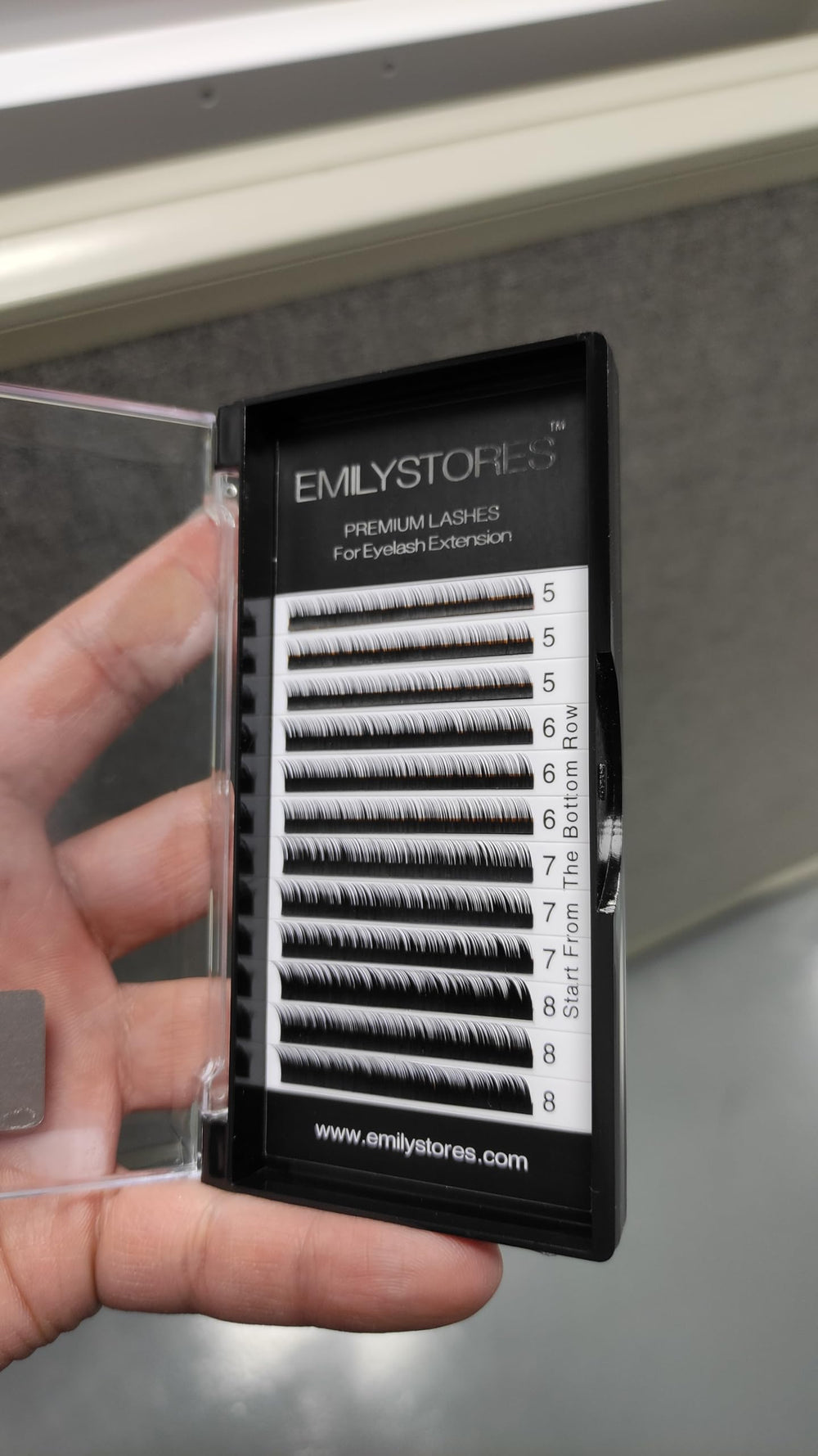 EMILYSTORES tray held in hand showing scale and mixed lengths for planning lower-lash maps