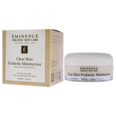 Eminence product beside ingredients and ruler for size comparison and transparency