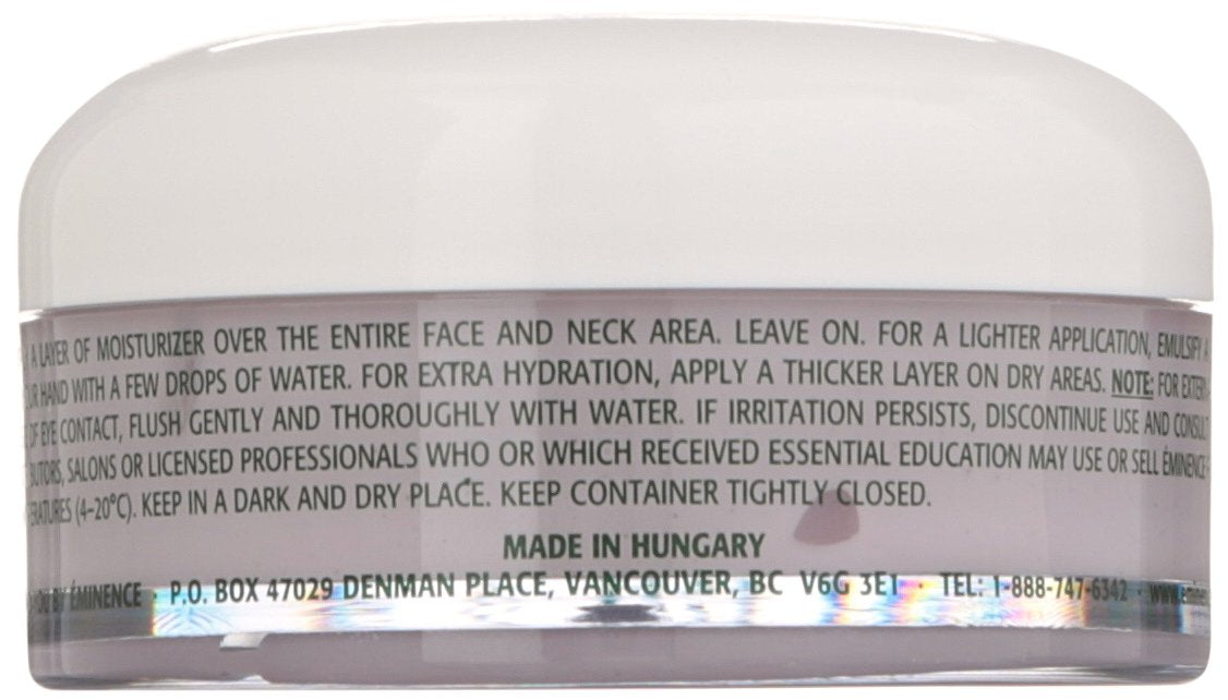 Eminence jar in hand for scale showing compact travel-friendly 2 fl oz