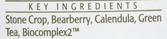 Eminence Stone Crop bottle next to hand to show 4.2 ounce scale and travel-friendly convenience