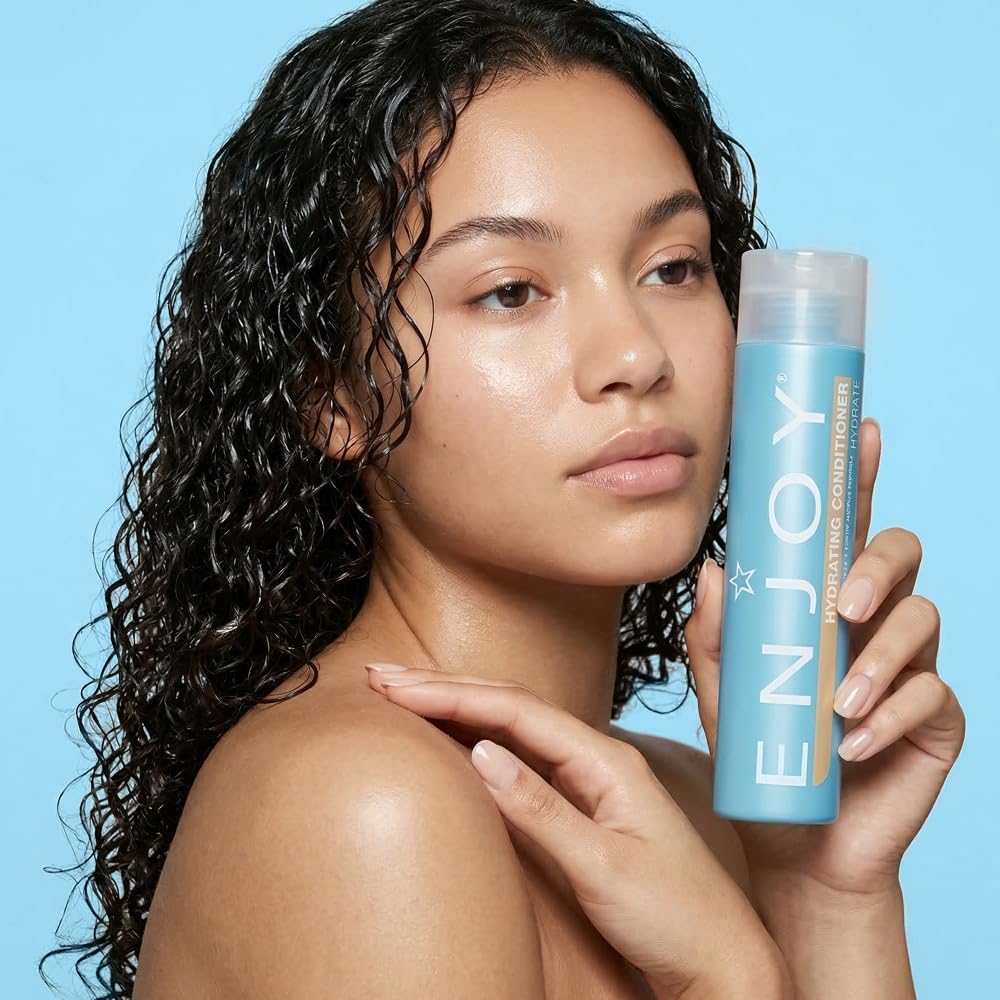 Enjoy conditioner on bathroom shelf with styling tools showing everyday routine benefit