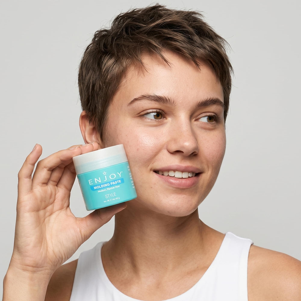 Enjoy molding paste on bathroom counter in lifestyle scene suggesting everyday grooming convenience