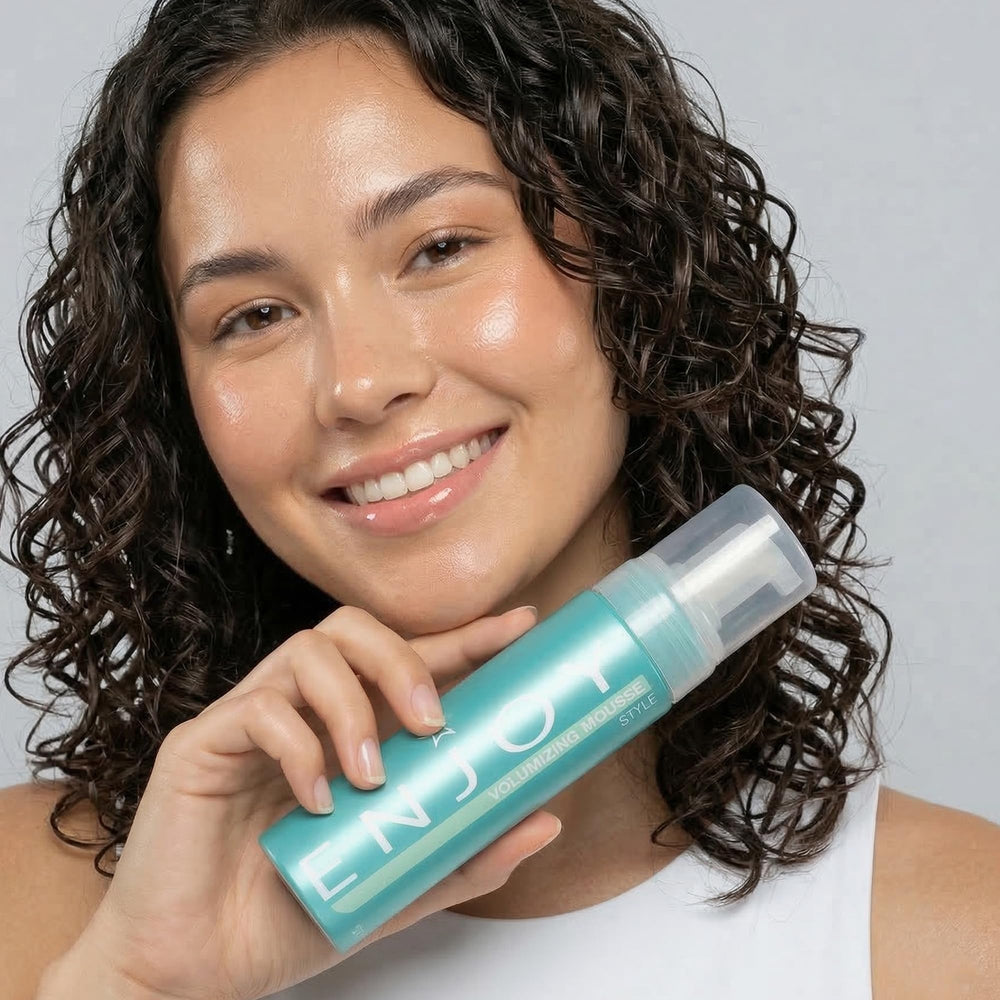 Enjoy styled hair in lifestyle shot showing lifted volume and glossy finish