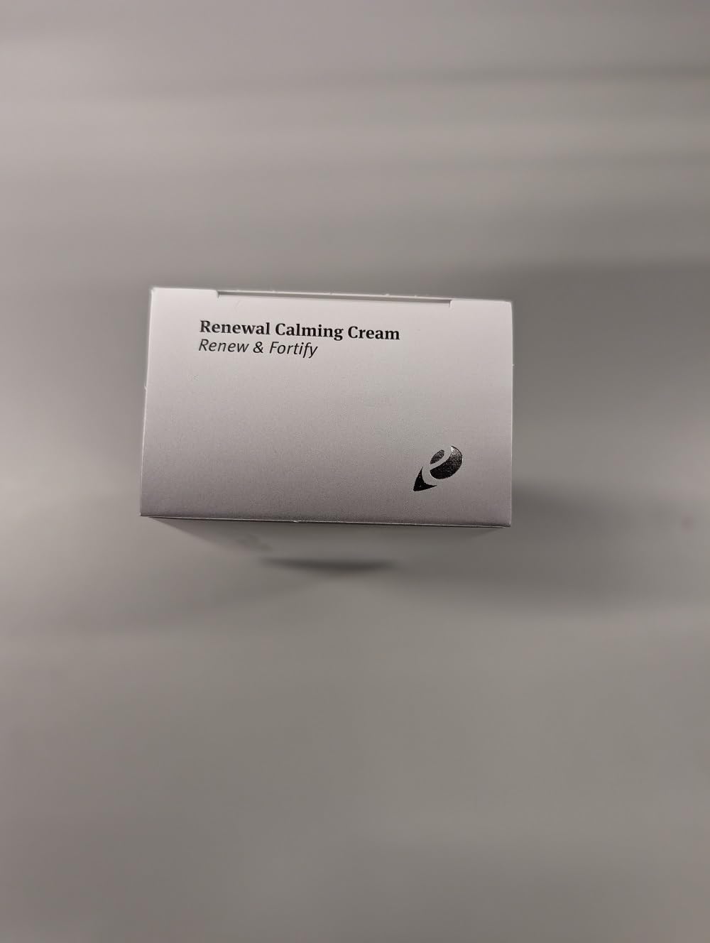 Epionce Renewal Calming Cream label close-up showing fragrance-free, paraben-free benefits