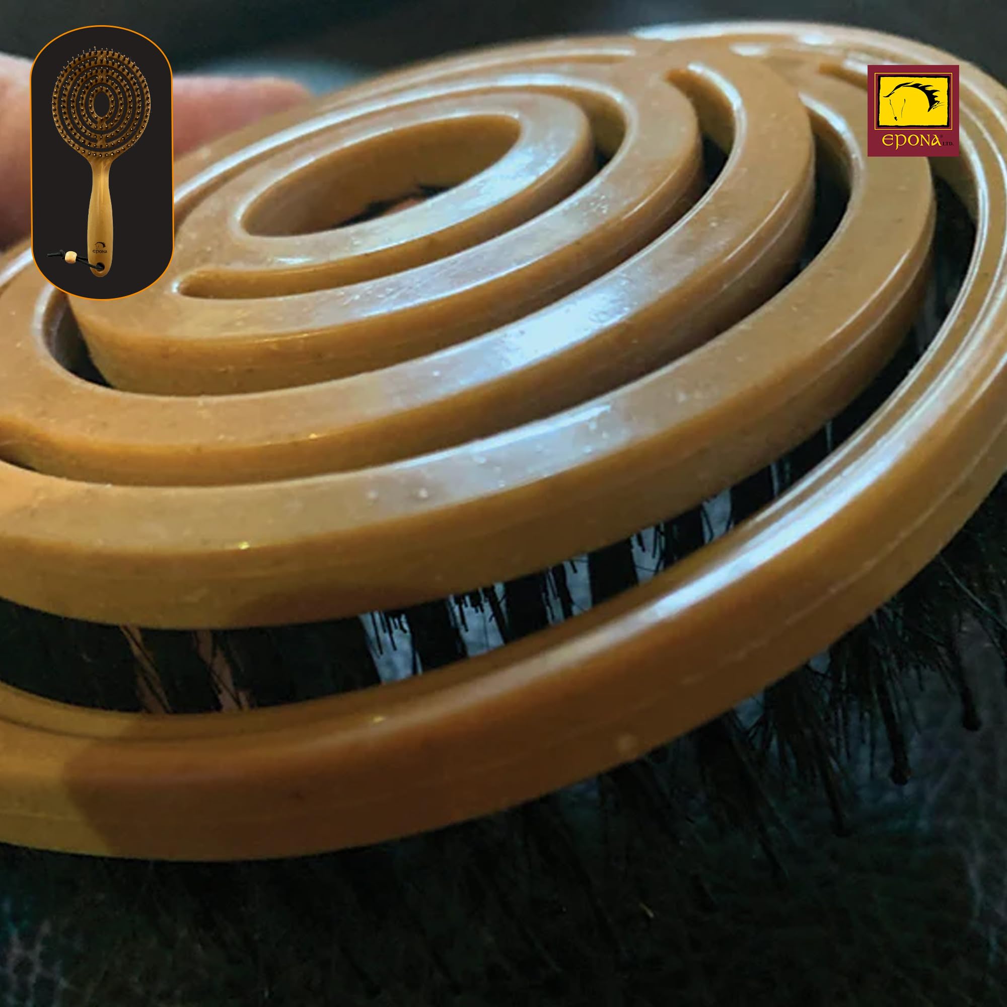 Epona brush held in hand to show scale and easy transport benefit