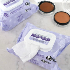 Equate wipe in hand removing eye makeup demonstrating effective cleansing