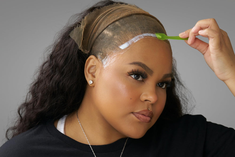 Ericka J adhesive on lace with water droplets demonstrating waterproof protection