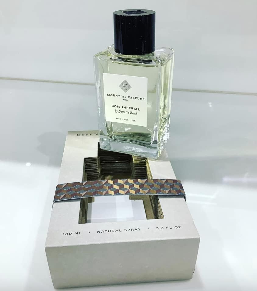 Essential Parfums Bois Imperial spray demonstration on wrist conveying easy application