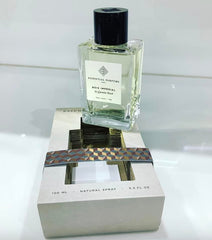 Essential Parfums Bois Imperial spray demonstration on wrist conveying easy application