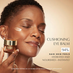 Estée Lauder balm being applied with finger to under-eye for visible nourishment