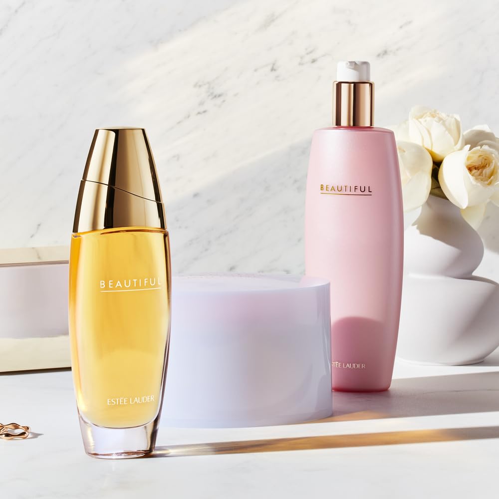 Estée Lauder bottle with roses and lilies showing floral inspiration