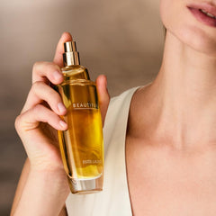 Estée Lauder close-up of glass and liquid color conveying luxe texture