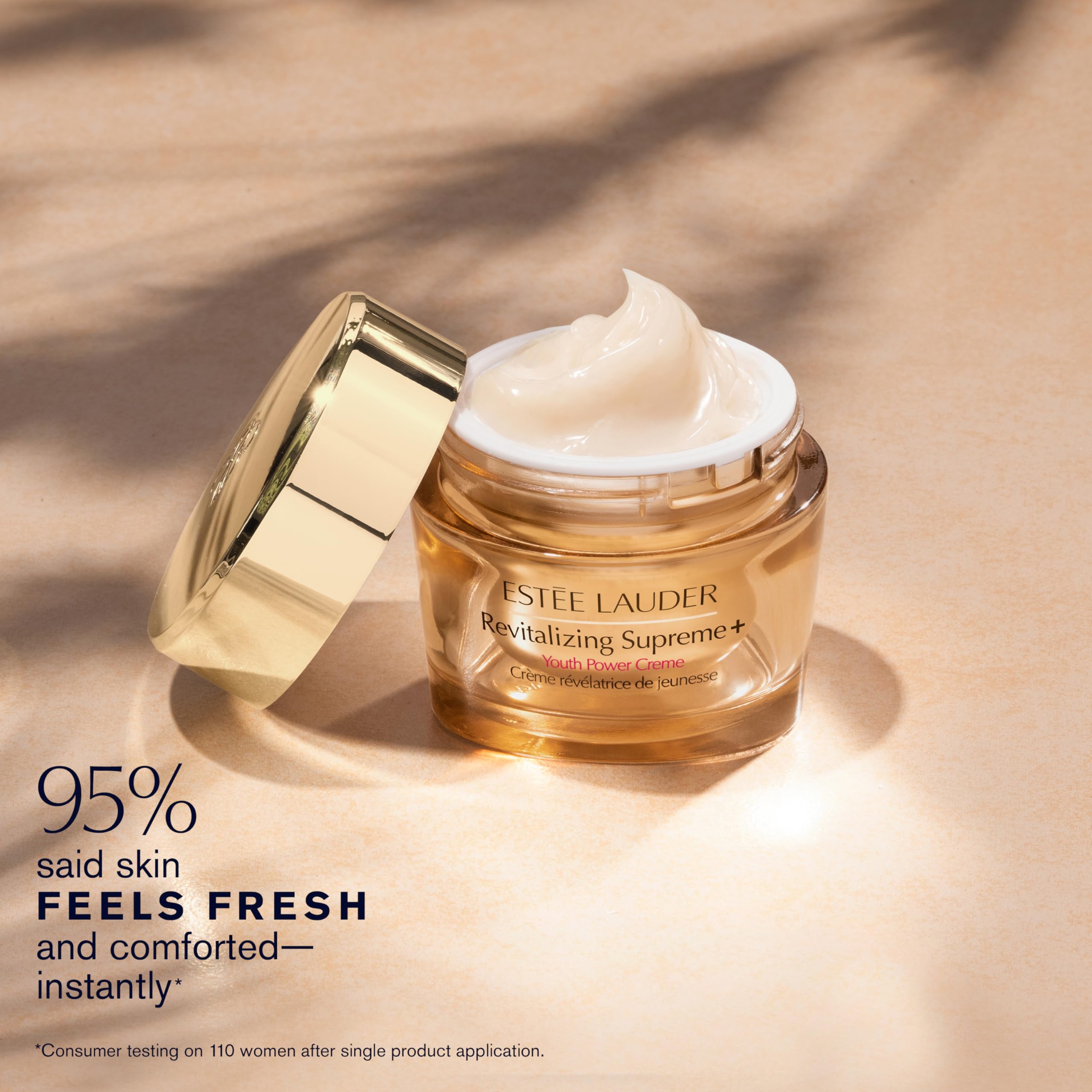 Estée Lauder cream held in hand to show actual size and application benefit