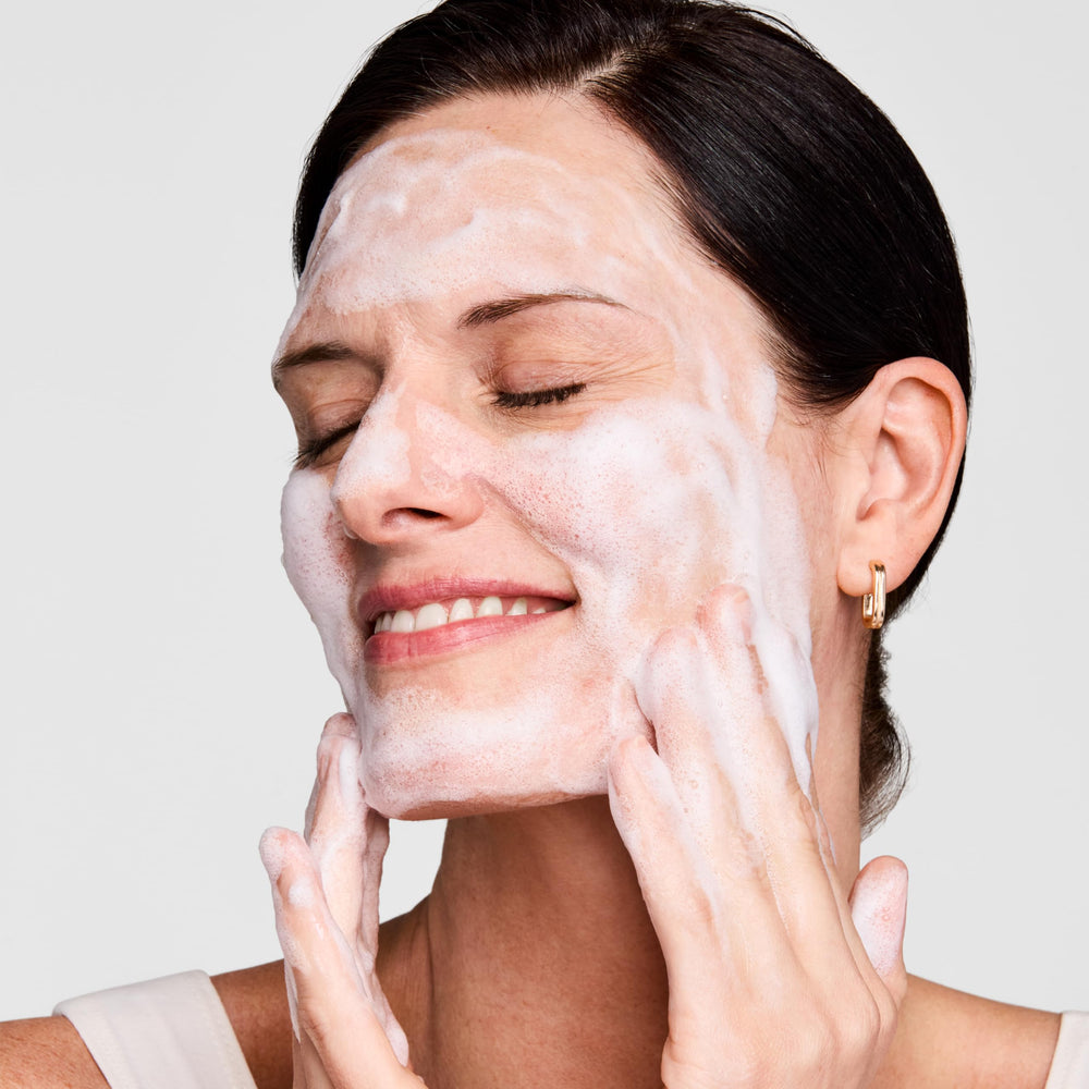 Estée Lauder mask applied on cheek illustrating quick three-minute purify benefit