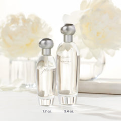 Estée Lauder Pleasures mist sprayed from bottle showing easy application and fine spray