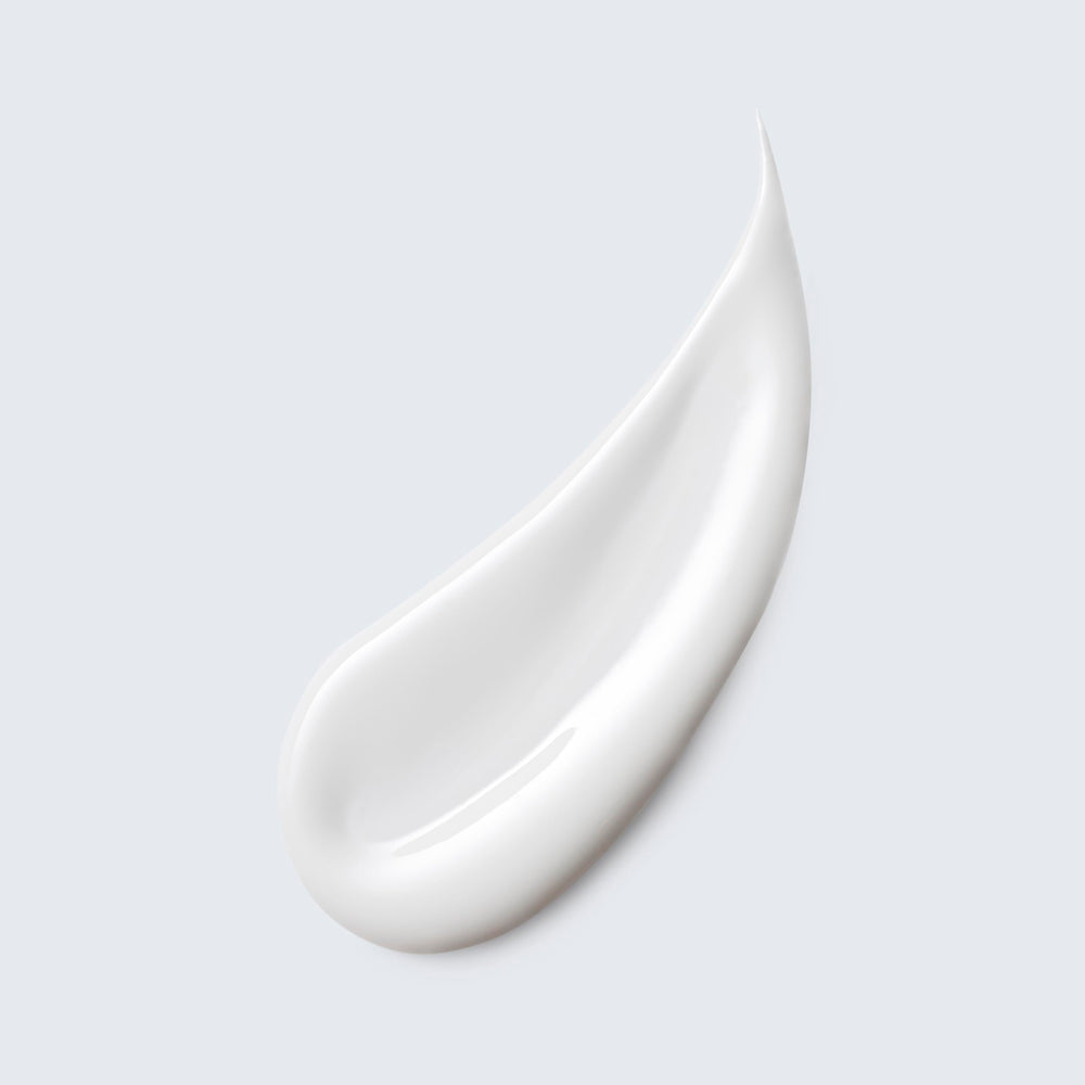 Estée Lauder milky lotion texture close-up demonstrating smooth, hydrating finish