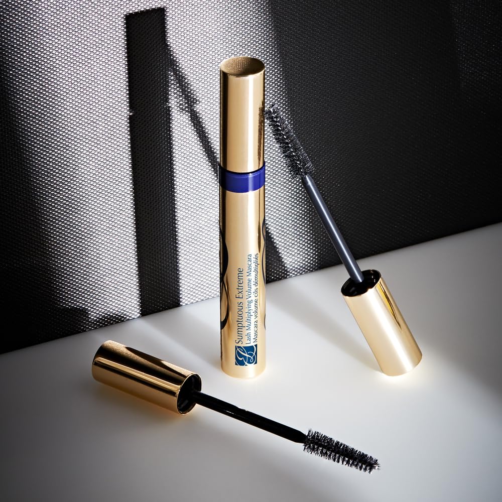 Estée Lauder travel-size tube held in hand showing portable scale benefit