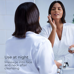 Eucerin night cream held in hand to show 2.5 oz size and travel-friendly benefit