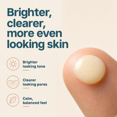 Eva Naturals bottle in hand to show actual 1 oz scale and portability
