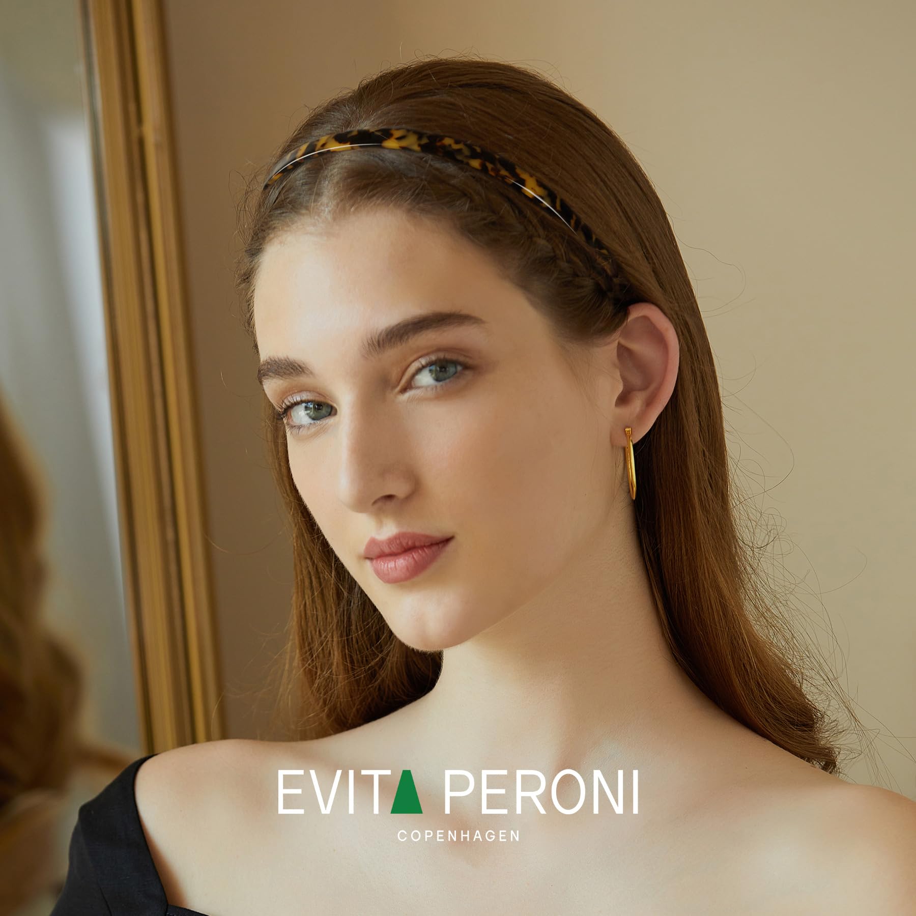 EVITA PERONI close-up of acetate texture showing glossy durable finish benefit
