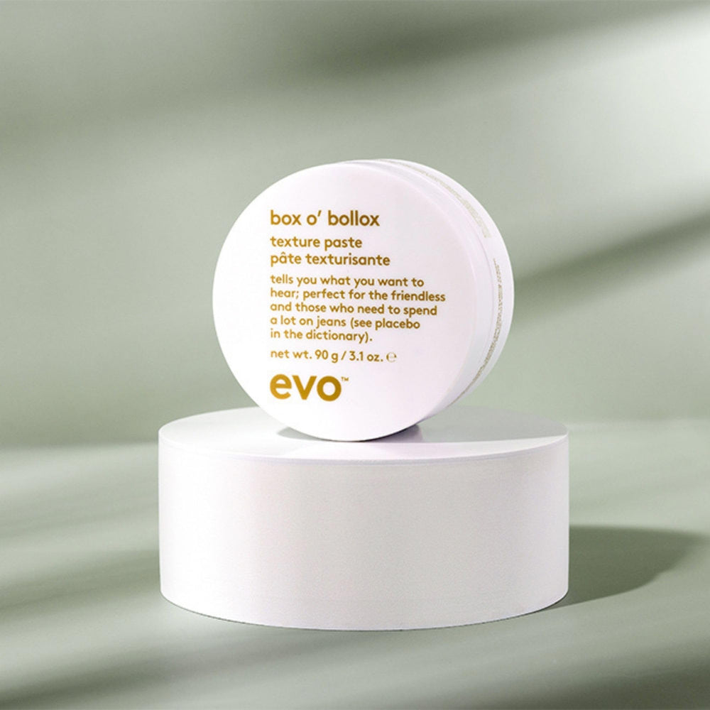 EVO Box O' Bollox next to a coin for scale highlighting the 3.1 oz travel-friendly size