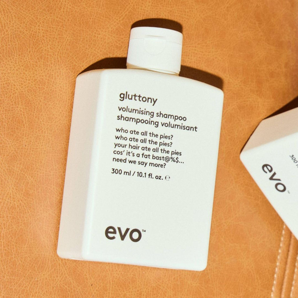 EVO Gluttony on bathroom shelf with styling tools showing routine-ready benefit