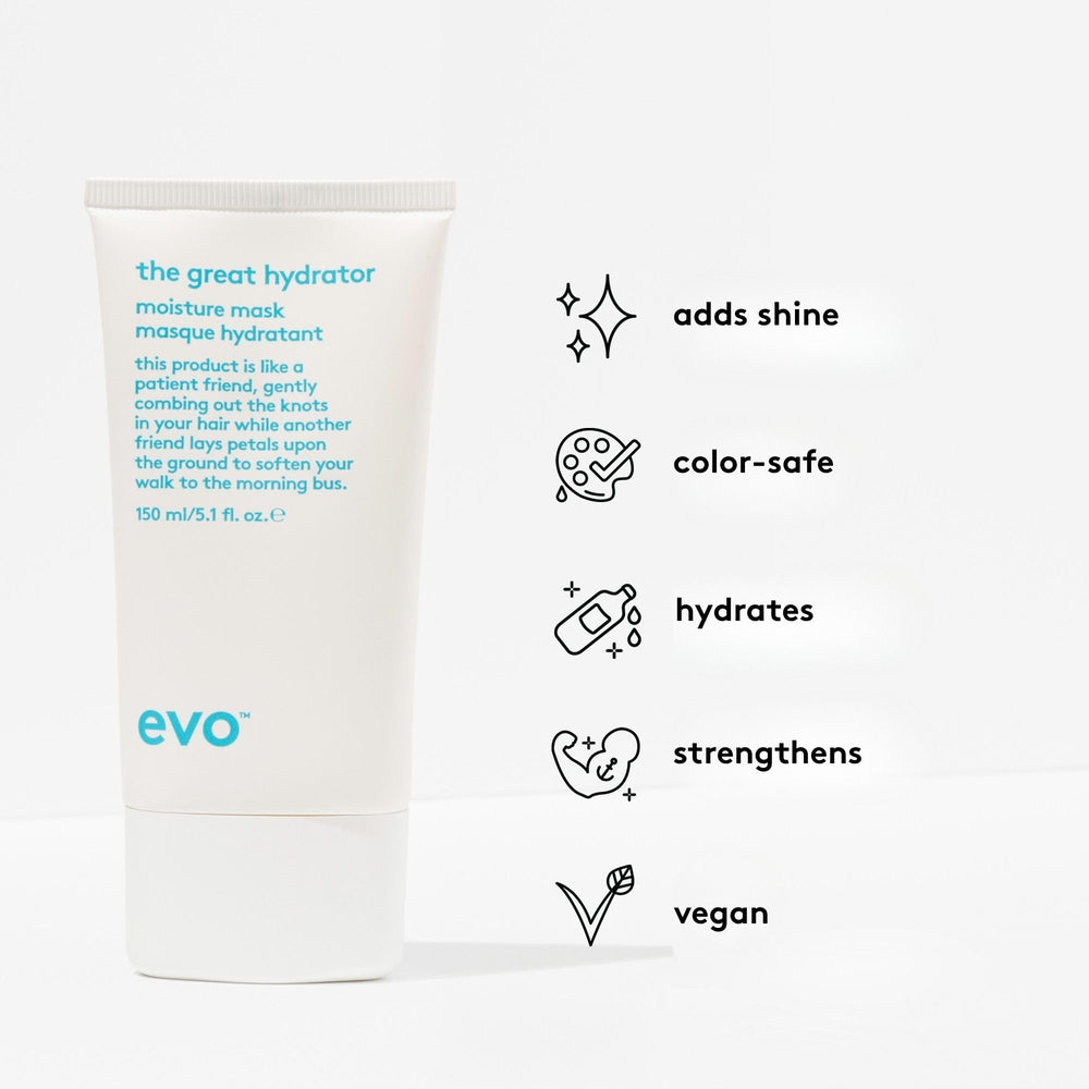 EVO hand applying mask to wet hair, demonstrates easy application and slip