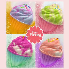Excalla bath bomb fizzing in bathtub producing bubbles and color for playful baths