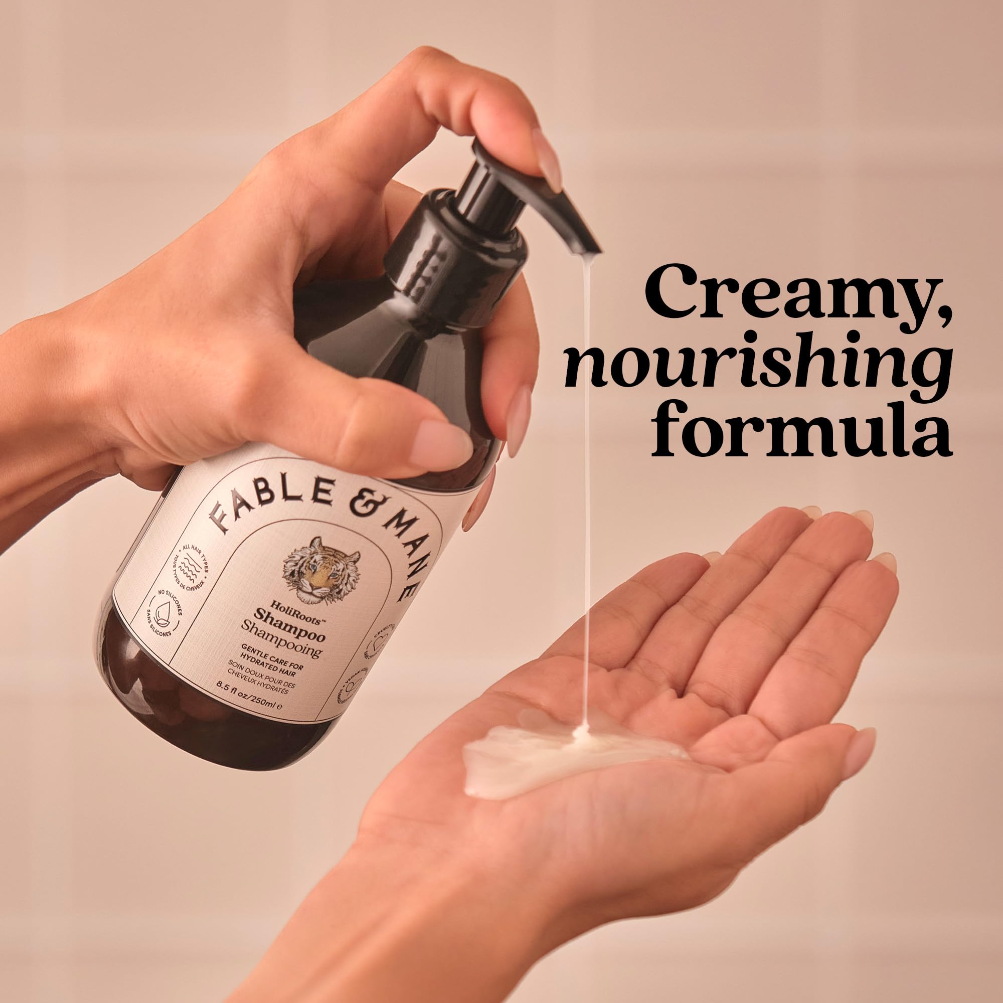 Fable & Mane bottle in hand to show size and travel-friendly scale