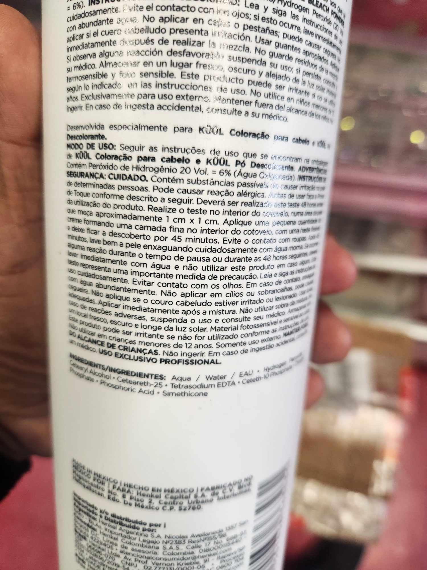 Fantasy Nails Kuül bottle held in hand to show 29.42 fl oz size advantage