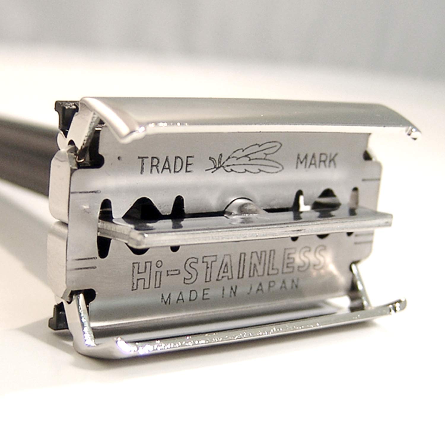 Feather blade insertion scene showing Hi-Stainless blade placement and safe alignment
