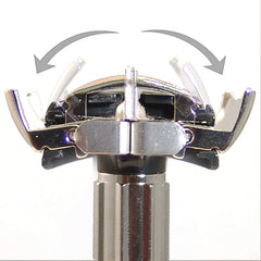 Feather butterfly opening mechanism displayed mid-twist for easy blade changes