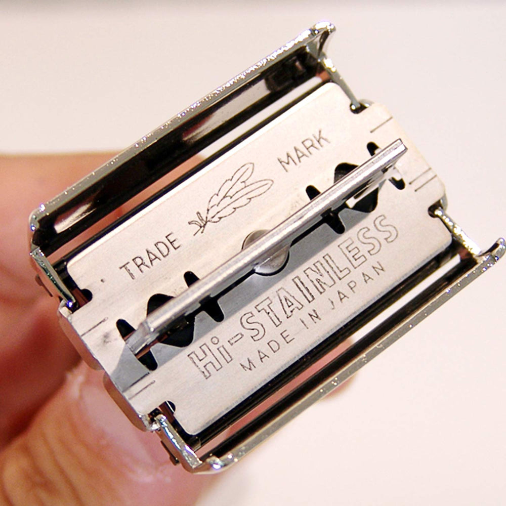 Feather size comparison with ruler highlighting compact four-point-zero-five-inch handle