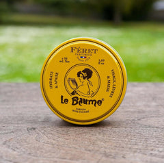 Feret Parfumeur open tin revealing smooth balm surface for easy fingertip use