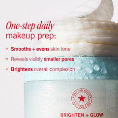 First Aid Beauty pad held in hand demonstrating convenient single-step use