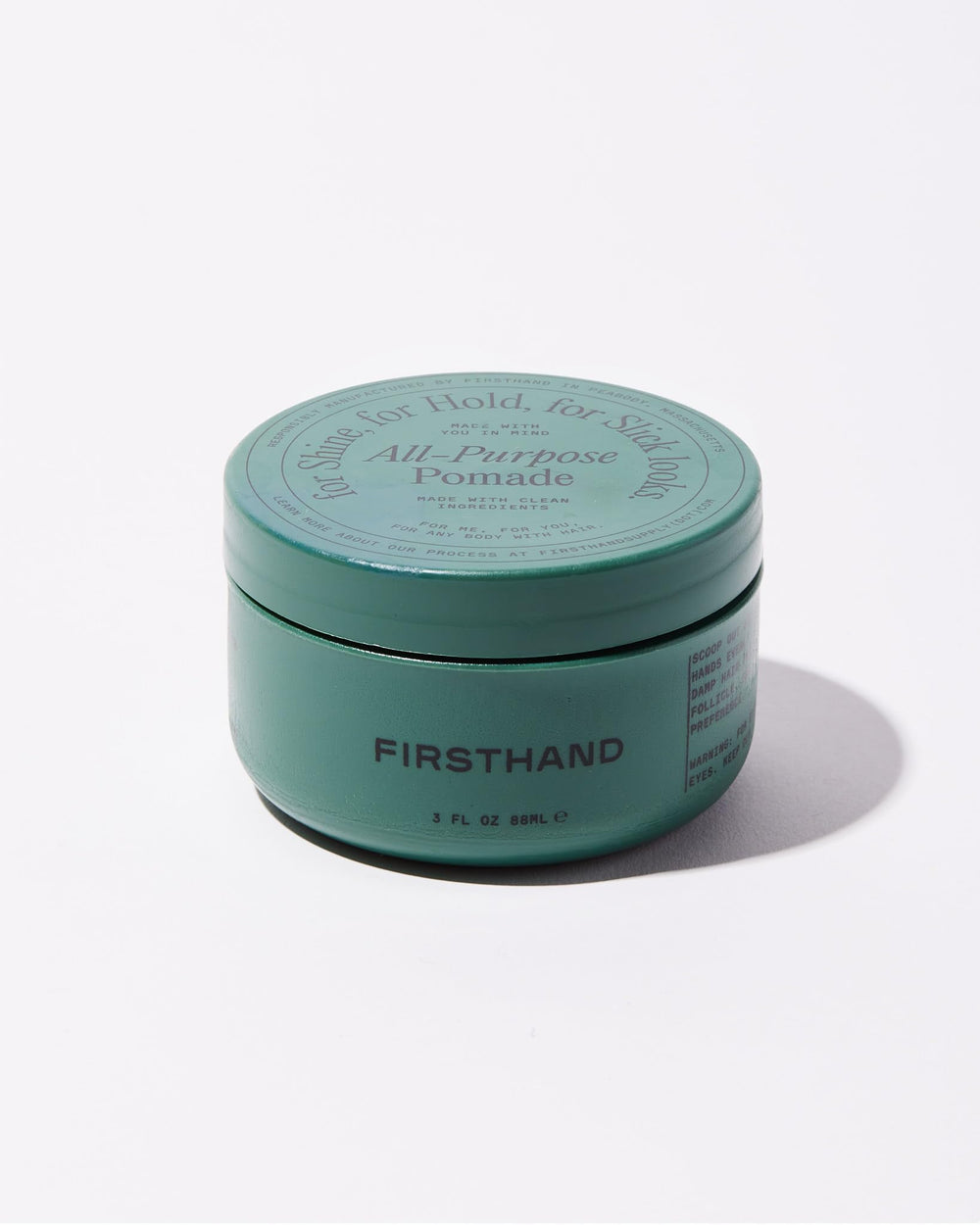Open tub close-up showing creamy pomade texture and easy scoop benefit