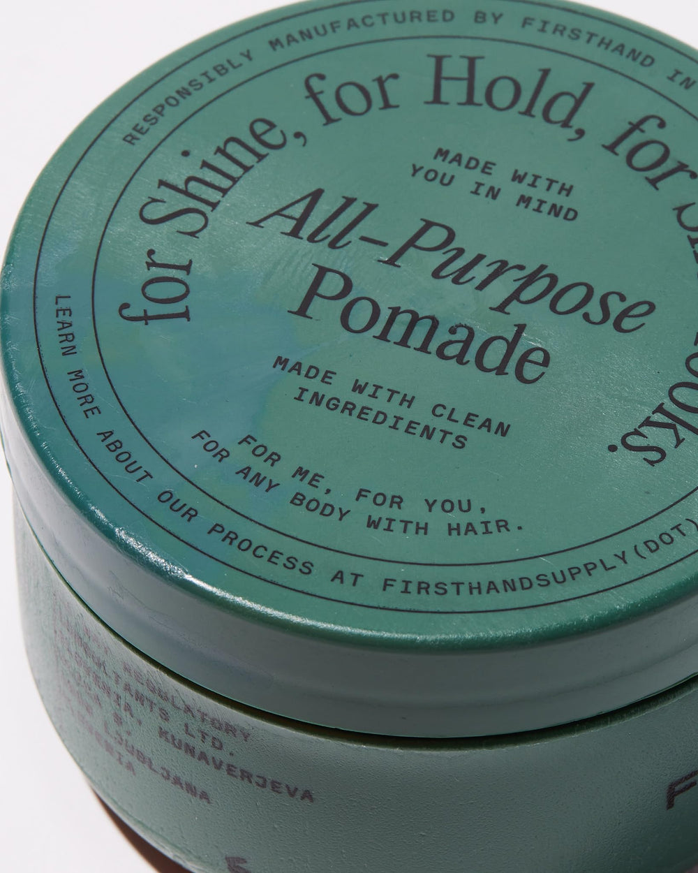 Rinsing Firsthand Supply pomade under water showing easy washout benefit