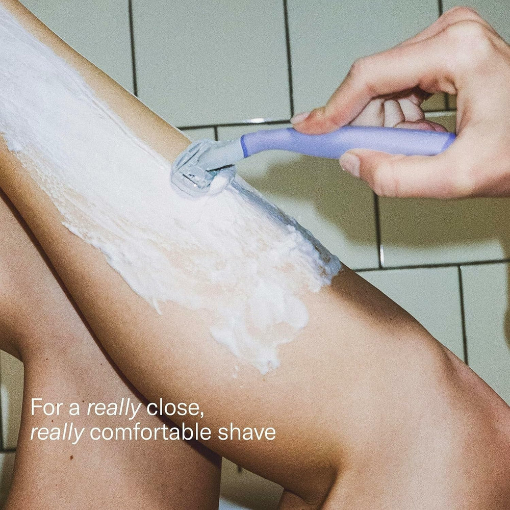 Flamingo razor in use on leg demonstrating smooth glide and contouring