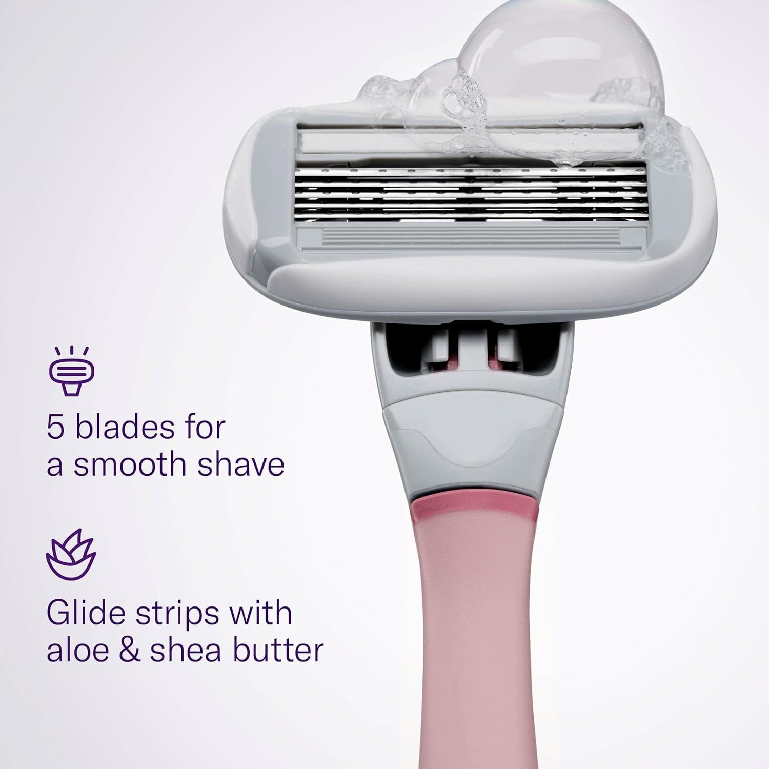 Flamingo razor in use on leg demonstrating flexible head for contour shaving