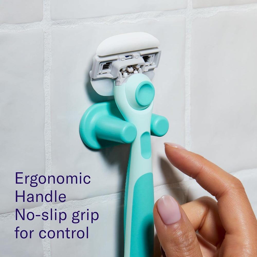 Flamingo razor next to common objects to show compact size and portability