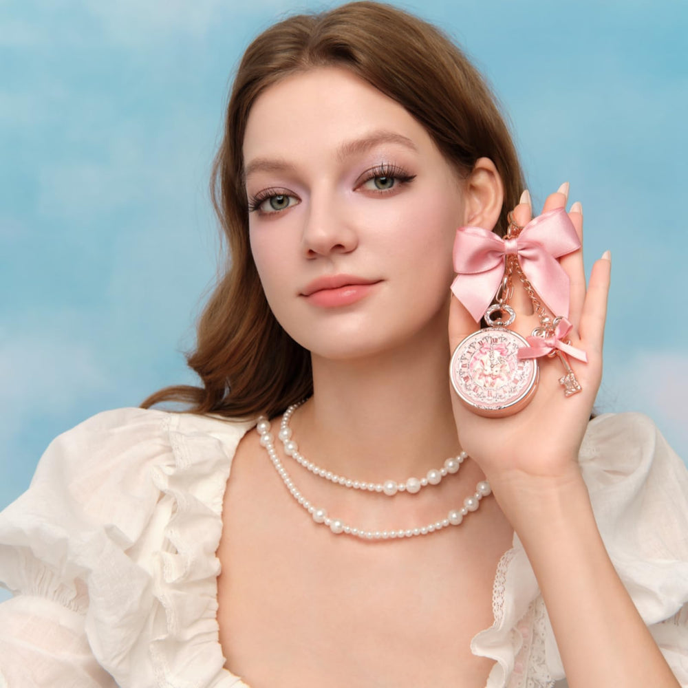 Flower Knows lip balm exposed from top showing smooth, glossy texture