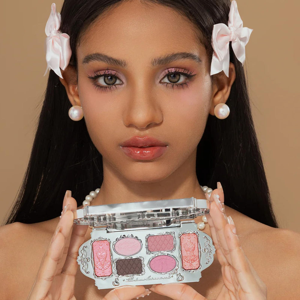 Flower Knows swatches on arm demonstrating buildable pink and shimmer shades